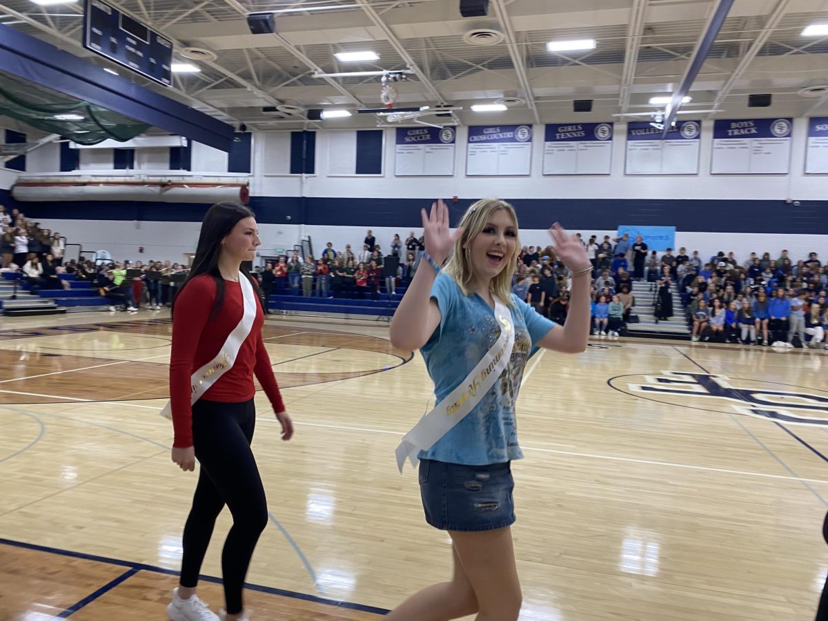 Sophomore Homecoming Court representative, Vicky Larson, takes her walk around the Homecoming Pep Fest.