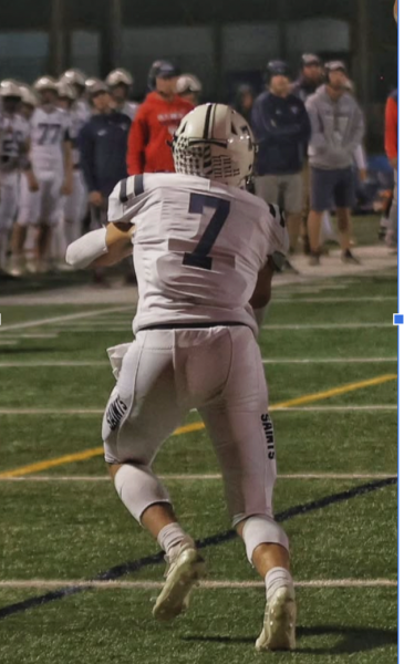 Owen Lamson, Saints Football player #7, on the field for his senior year.